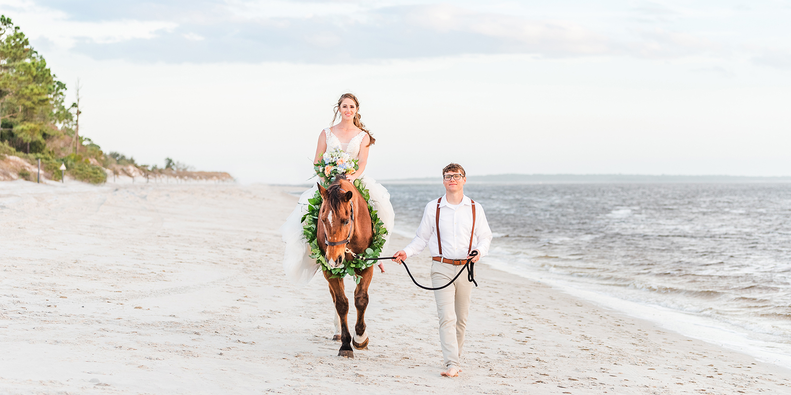 Horses on the beach at a wedding